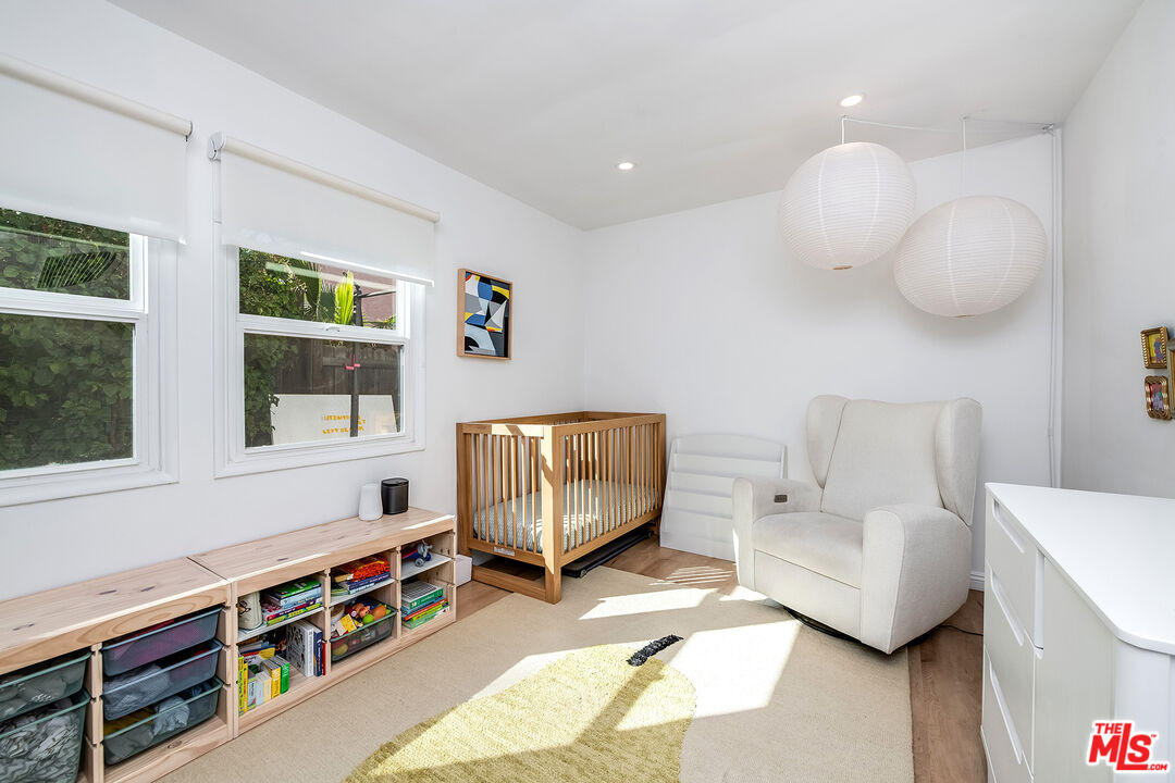 6660 Amigo Avenue Reseda, CA 91335 - Photo 22 of 25 a bedroom with furniture and a window