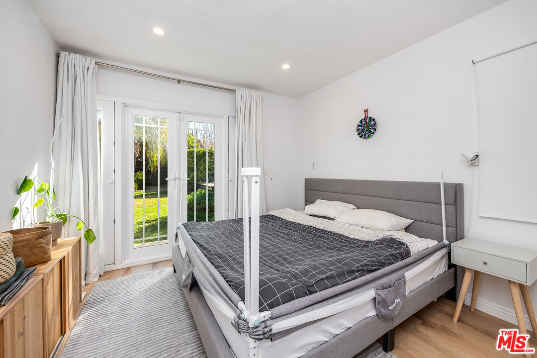 6660 Amigo Avenue Reseda, CA 91335 - Photo 24 of 25 a bed room with a bed and sliding door