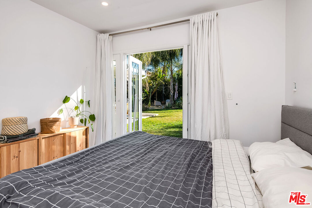 6660 Amigo Avenue Reseda, CA 91335 - Photo 25 of 25 a bedroom with a bed and a window