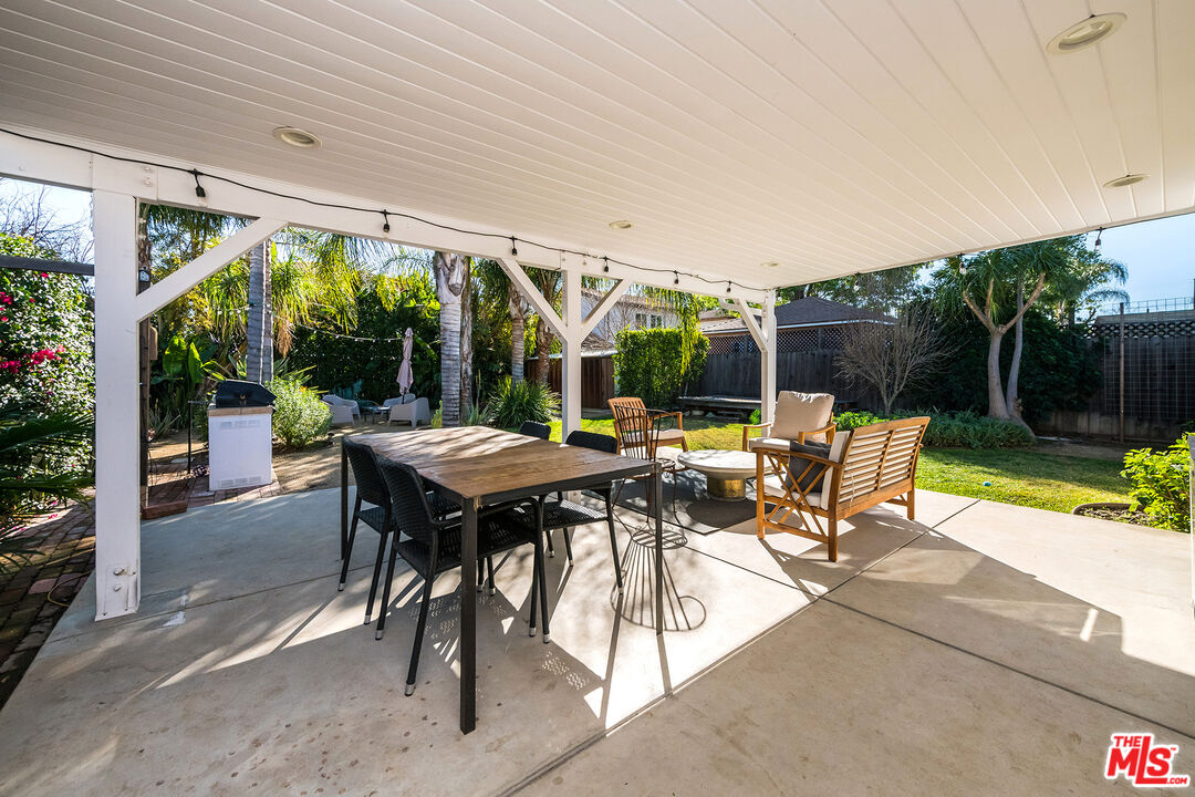 6660 Amigo Avenue Reseda, CA 91335 - Photo 10 of 25 a view of a patio with a table chairs and a backyard
