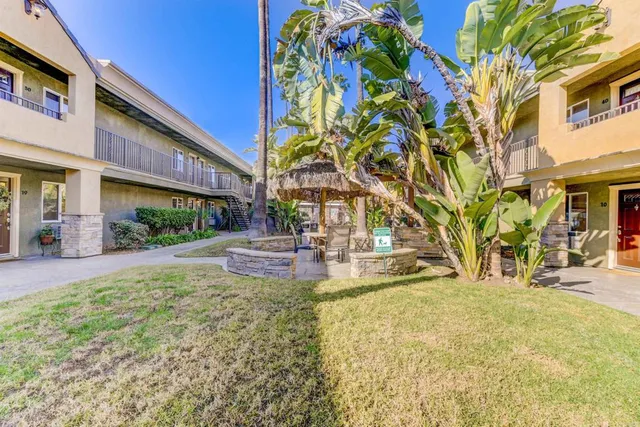 a view of a building with a yard