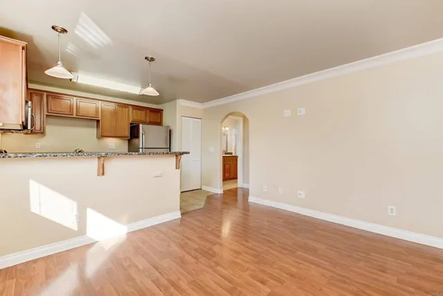 a view of a kitchen with a sink and a wooden floor