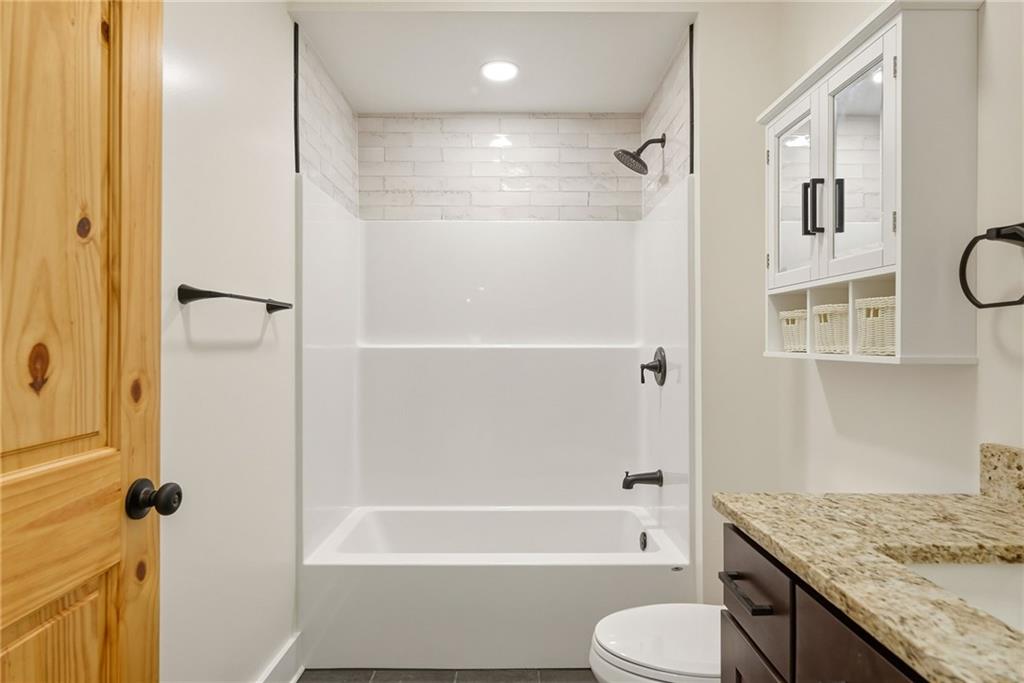 4844 Lucerne Road Indiana, PA 15701 - Photo 29 of 39 a bathroom with a granite countertop bathtub shower sink vanity and toilet