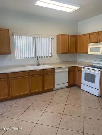 a kitchen with a cabinets and window