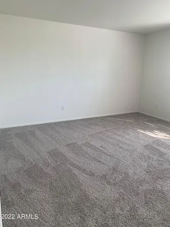 en empty room with windows