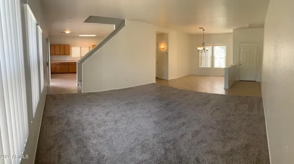 an empty room with windows and pillars in it