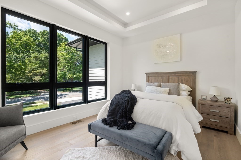55 Rosalie Road Newton, MA 02459 - Photo 15 of 42 a bedroom with a bed and a large window