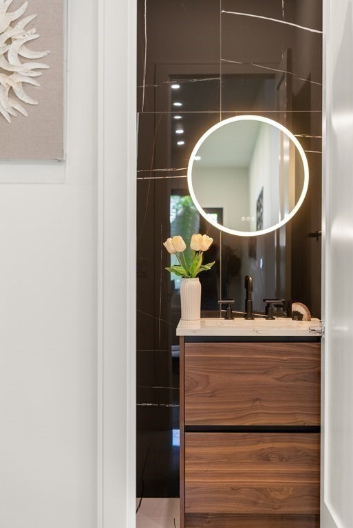 55 Rosalie Road Newton, MA 02459 - Photo 18 of 42 a bathroom with a sink and a mirror