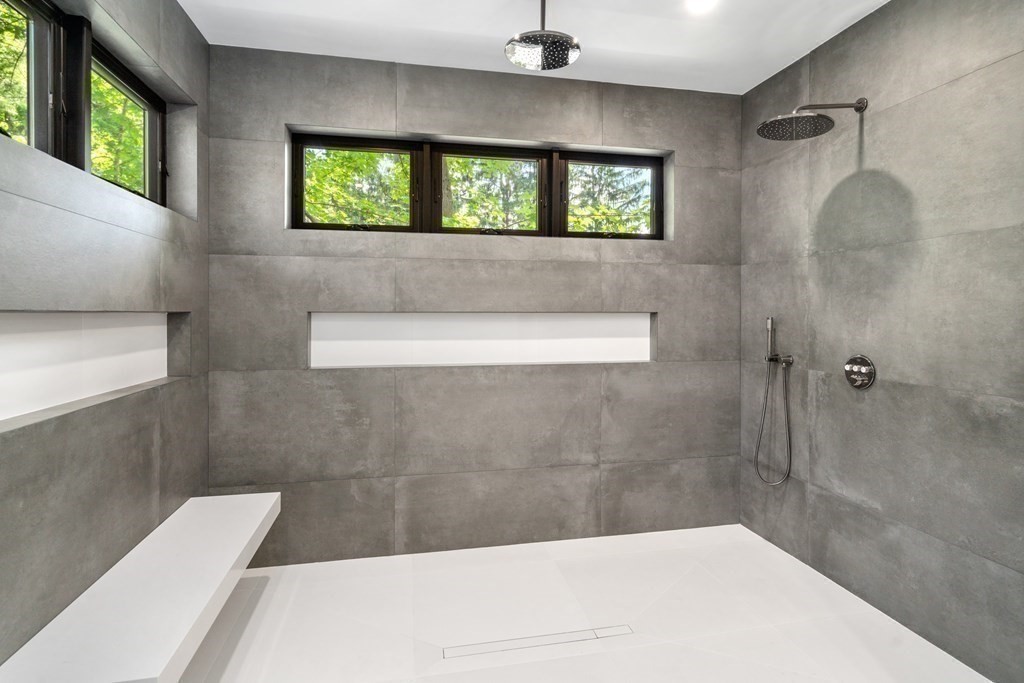 55 Rosalie Road Newton, MA 02459 - Photo 26 of 42 a bathroom with a bathtub and window