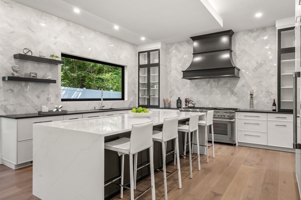 55 Rosalie Road Newton, MA 02459 - Photo 3 of 42 a kitchen with stainless steel appliances a sink stove and refrigerator