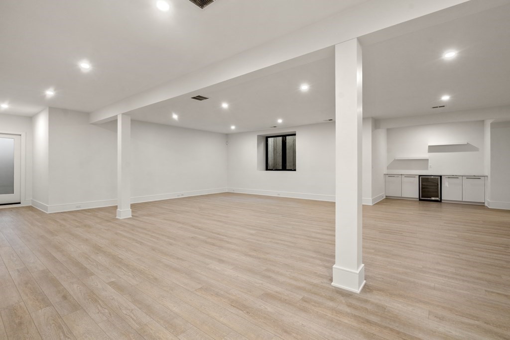 55 Rosalie Road Newton, MA 02459 - Photo 38 of 42 a view of empty room with wooden floor