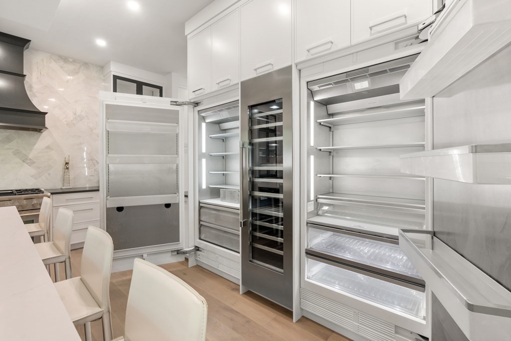 55 Rosalie Road Newton, MA 02459 - Photo 6 of 42 a bathroom with a double vanity sink toilet and shower