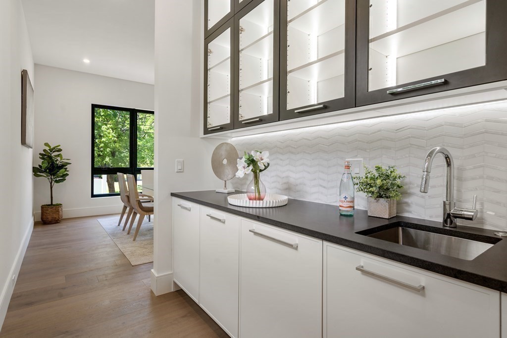 55 Rosalie Road Newton, MA 02459 - Photo 10 of 42 a kitchen with stainless steel appliances a sink and potted plant