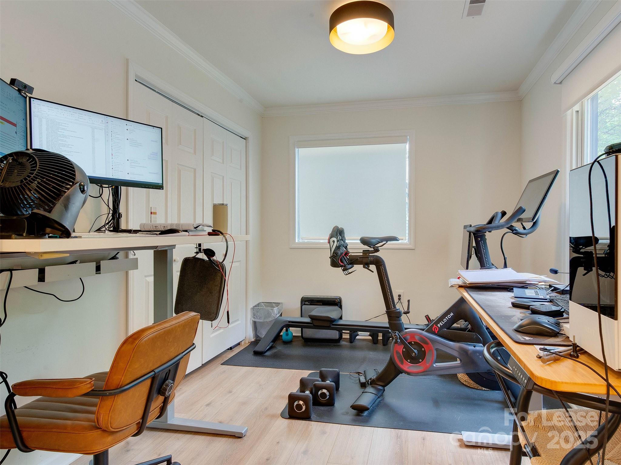 619 Fence Post Lane Matthews, NC 28105 - Photo 11 of 47 a view of a room with gym equipment