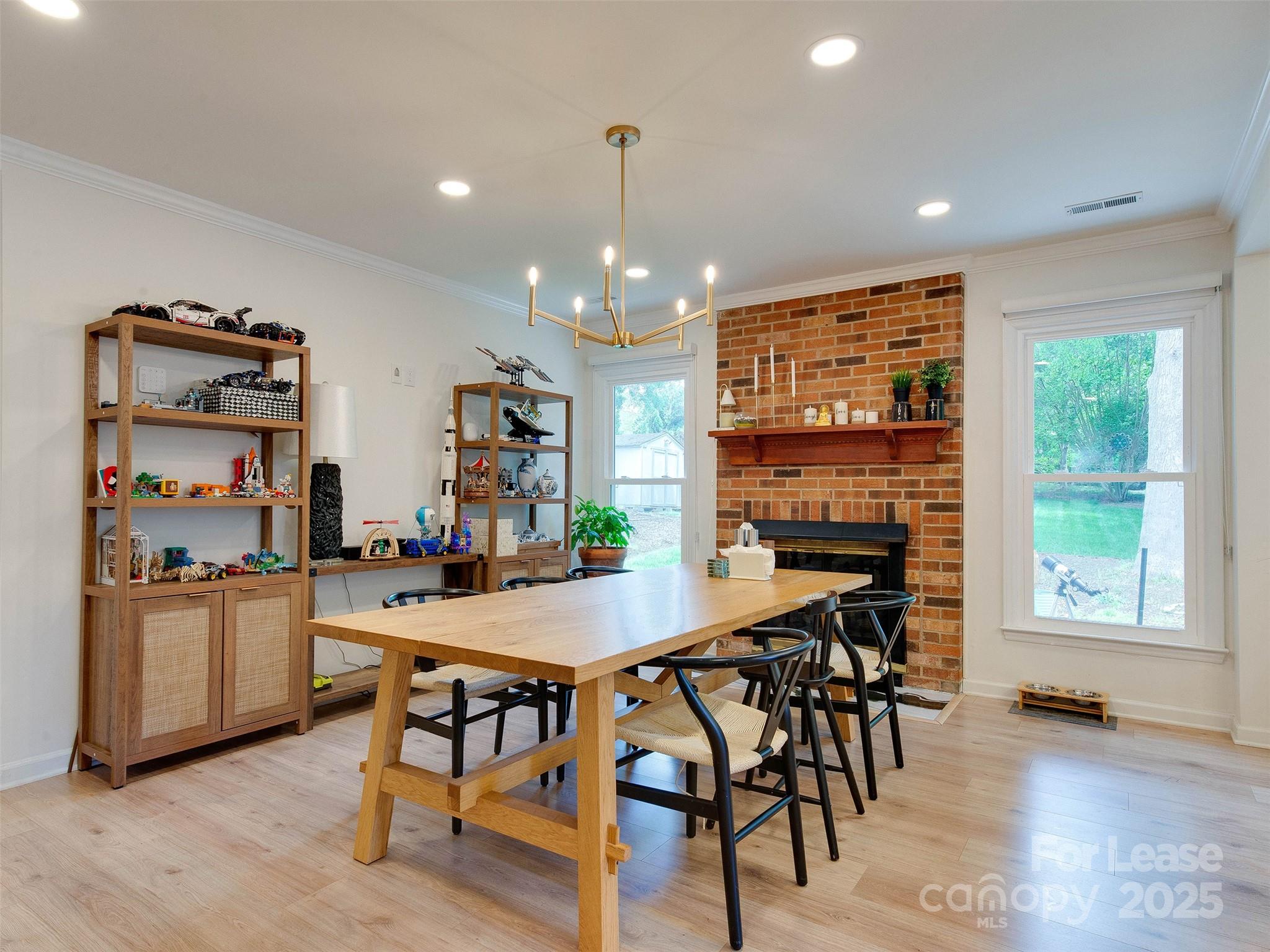 619 Fence Post Lane Matthews, NC 28105 - Photo 23 of 47 a view of a dining room with furniture window and wooden floor