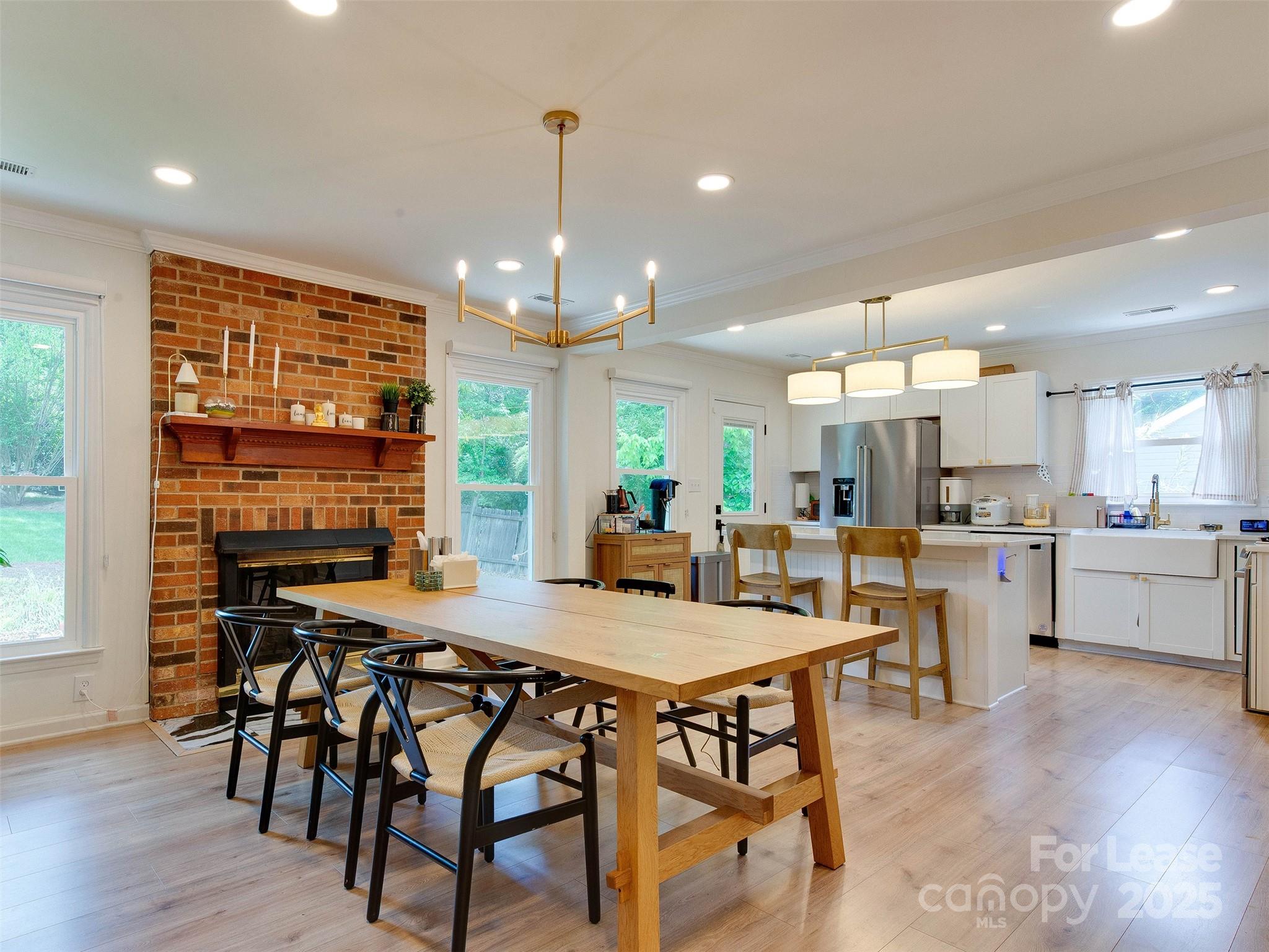 619 Fence Post Lane Matthews, NC 28105 - Photo 24 of 47 a view of a dining room with furniture and wooden floor