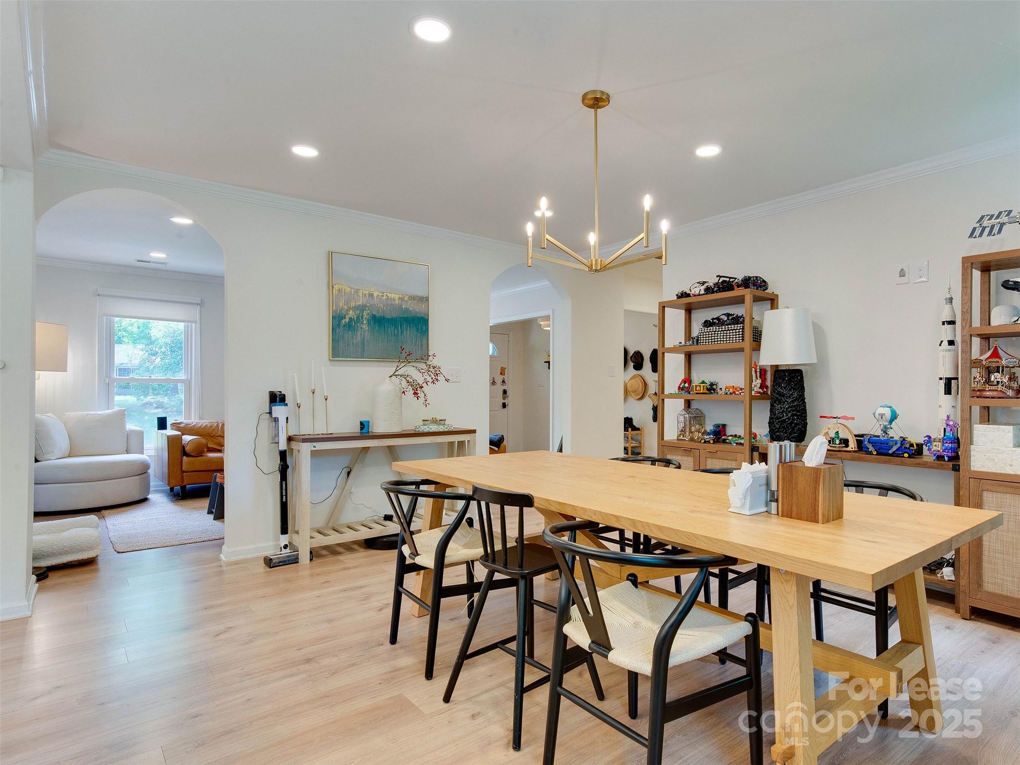 619 Fence Post Lane Matthews, NC 28105 - Photo 26 of 47 a view of a dining room with furniture and wooden floor