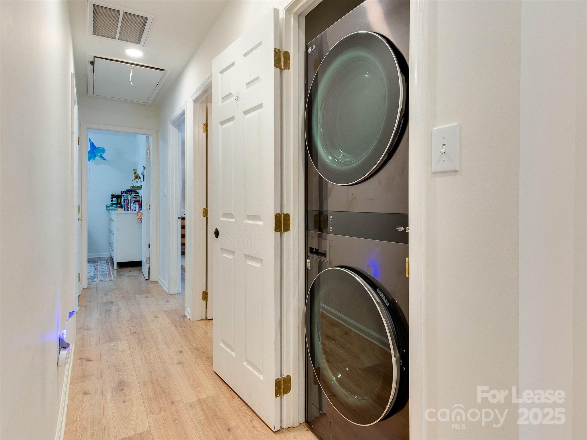 619 Fence Post Lane Matthews, NC 28105 - Photo 28 of 47 a view of a hallway with washer and dryer