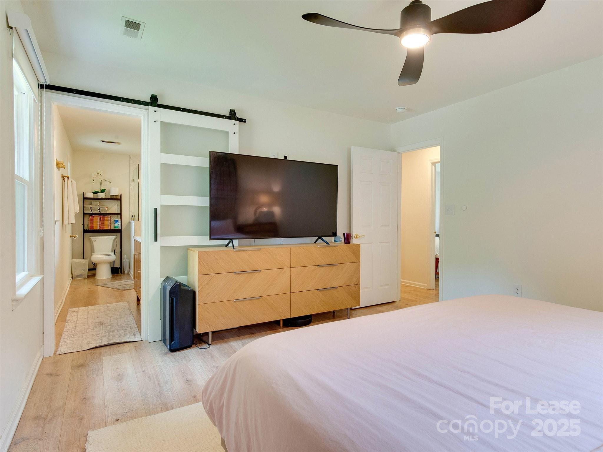 619 Fence Post Lane Matthews, NC 28105 - Photo 31 of 47 a bedroom with a bed and a flat screen tv