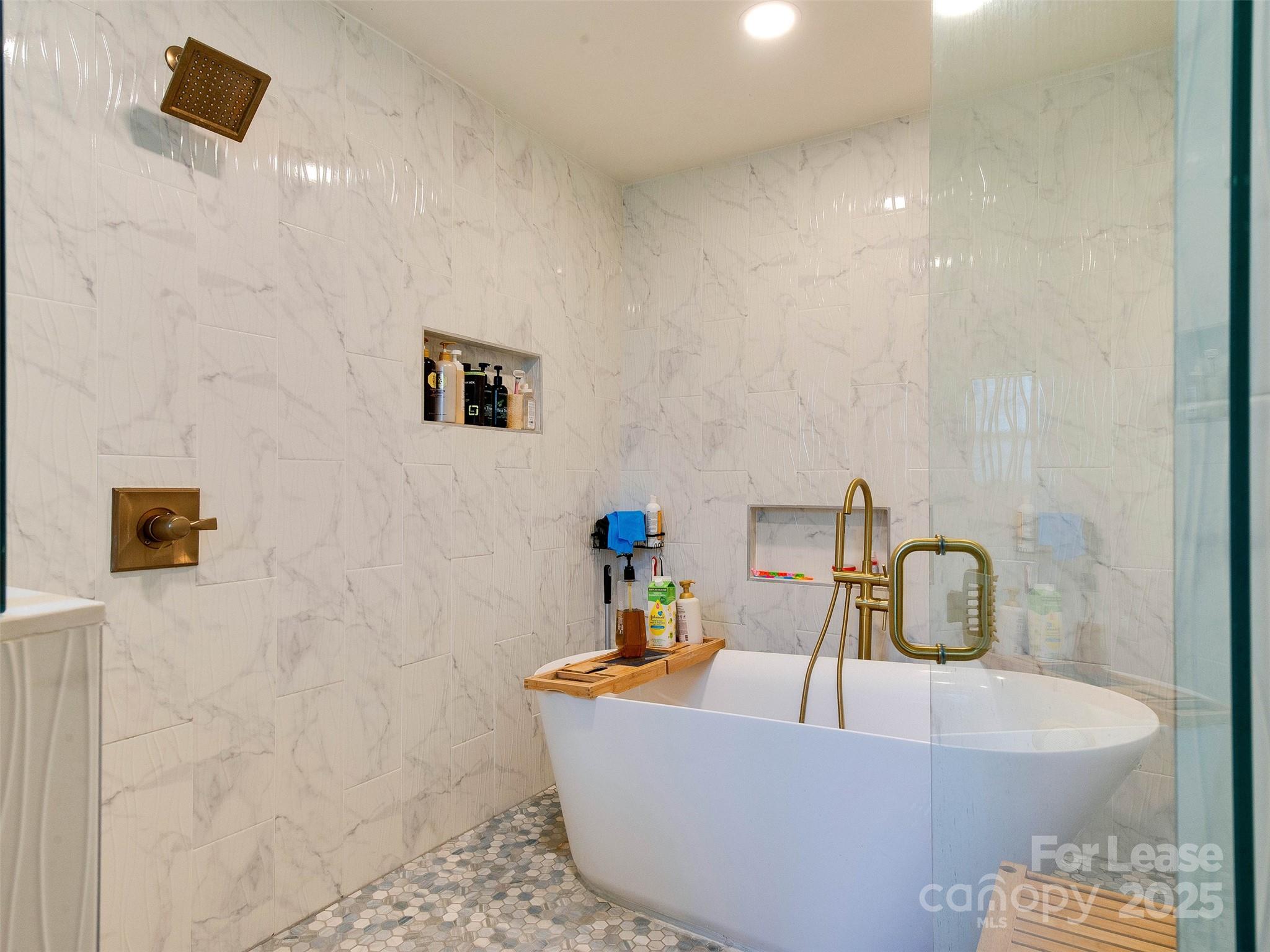 619 Fence Post Lane Matthews, NC 28105 - Photo 34 of 47 a bathroom with a sink mirror and tub