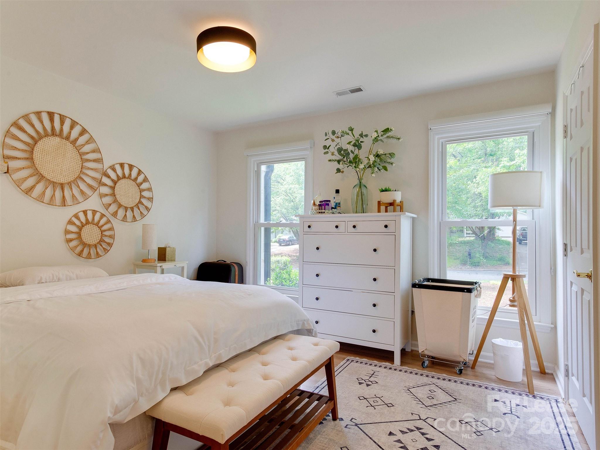 619 Fence Post Lane Matthews, NC 28105 - Photo 37 of 47 a bedroom with a bed and furniture