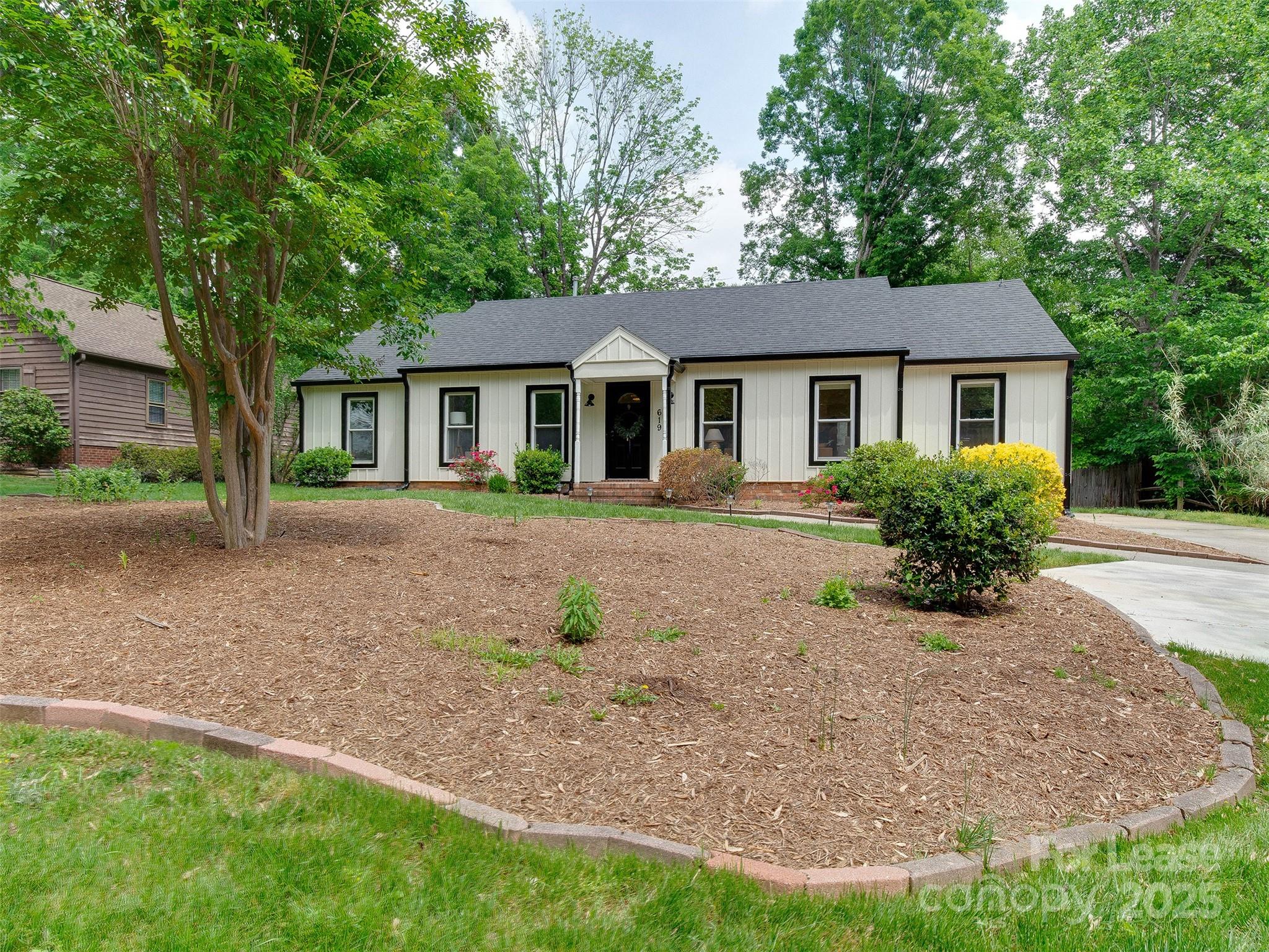 619 Fence Post Lane Matthews, NC 28105 - Photo 44 of 47 front view of a house with a yard