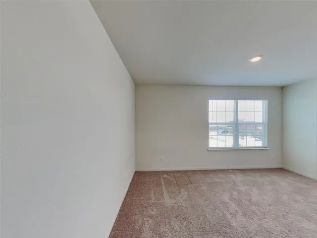 a view of a closet area with wooden floor
