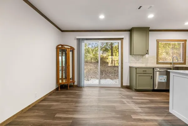 a view of a kitchen with a sink and a window