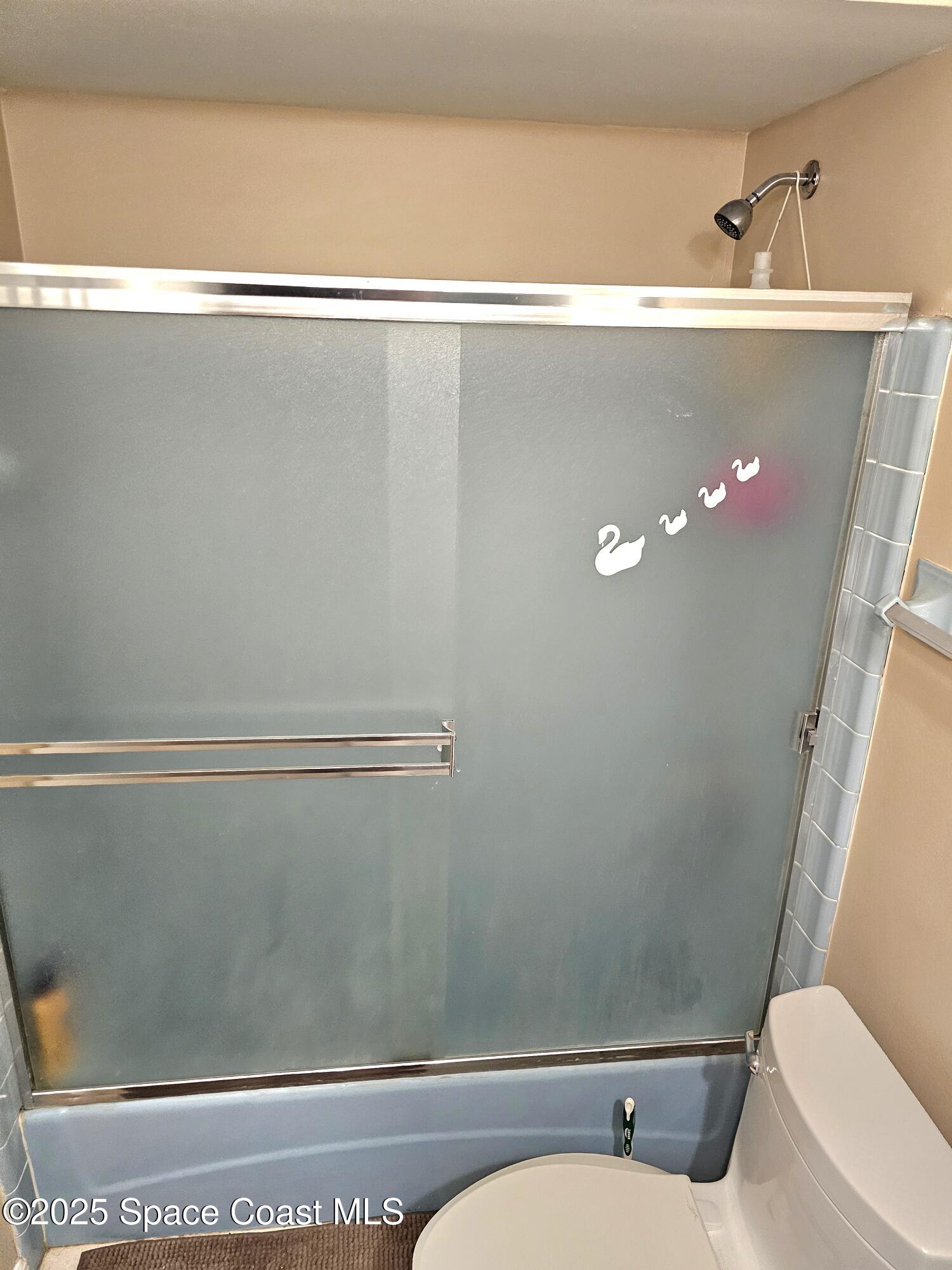 898 Hampton Drive Northeast Palm Bay, FL 32905 - Photo 15 of 20 a bathroom with a sink and toilet