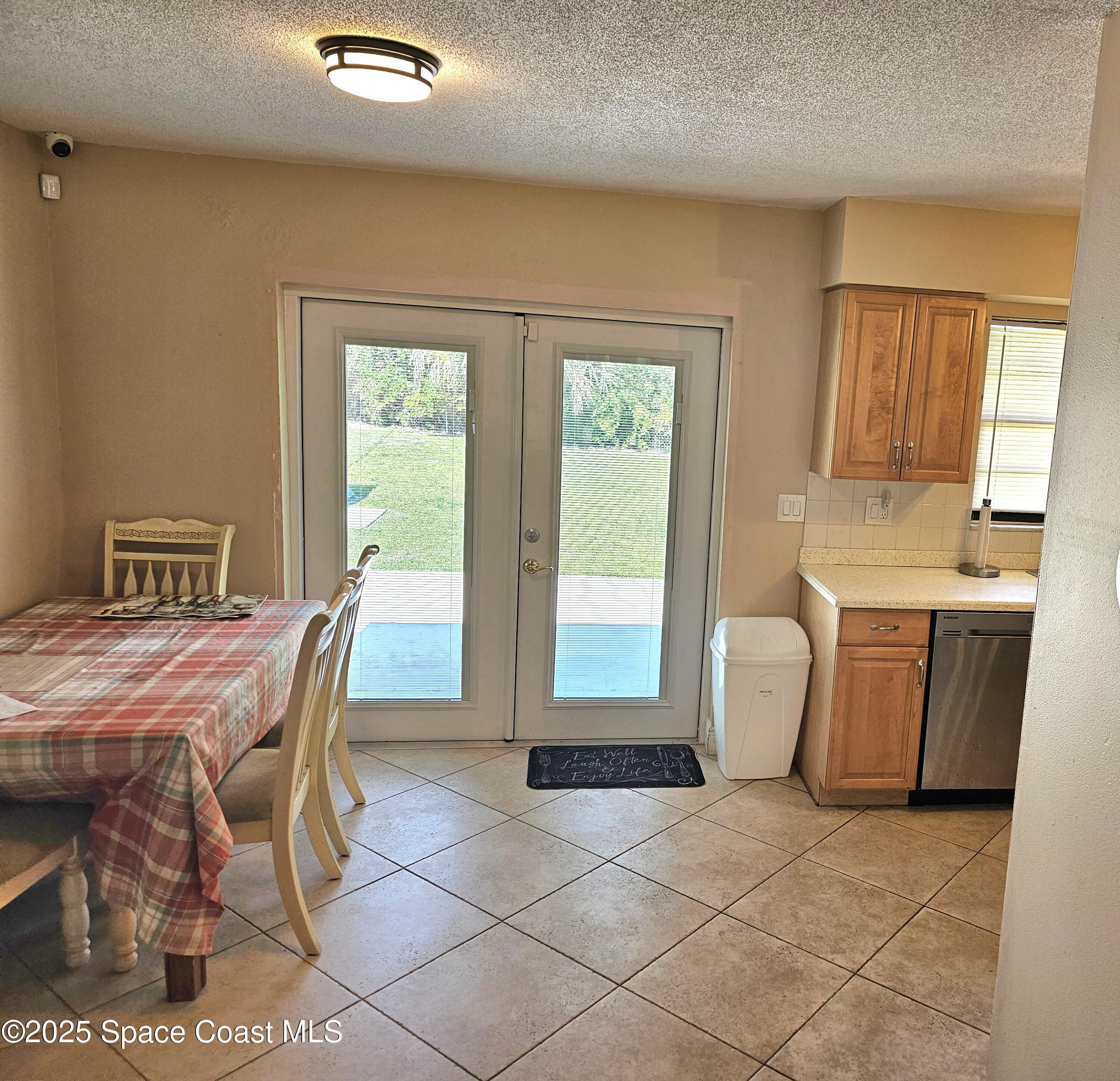 898 Hampton Drive Northeast Palm Bay, FL 32905 - Photo 5 of 20 a dining room with furniture and window