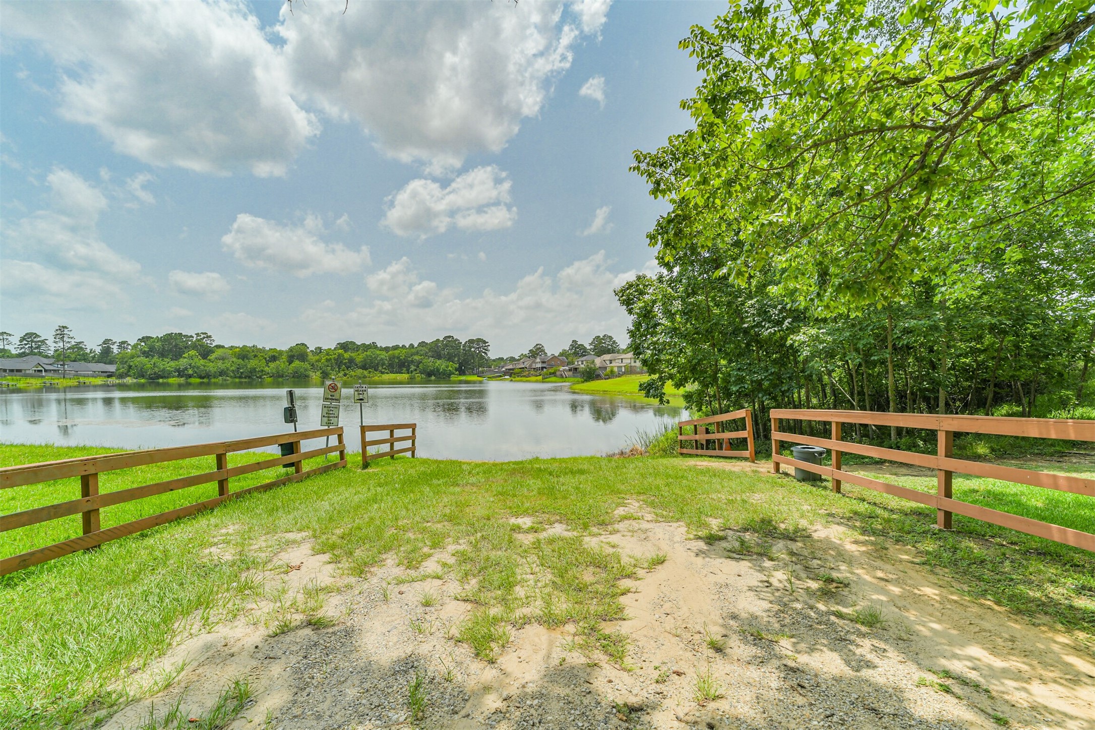 12009 La Salle River Road Conroe, TX 77304 - Photo 48 of 50 a view of a lake with a big yard