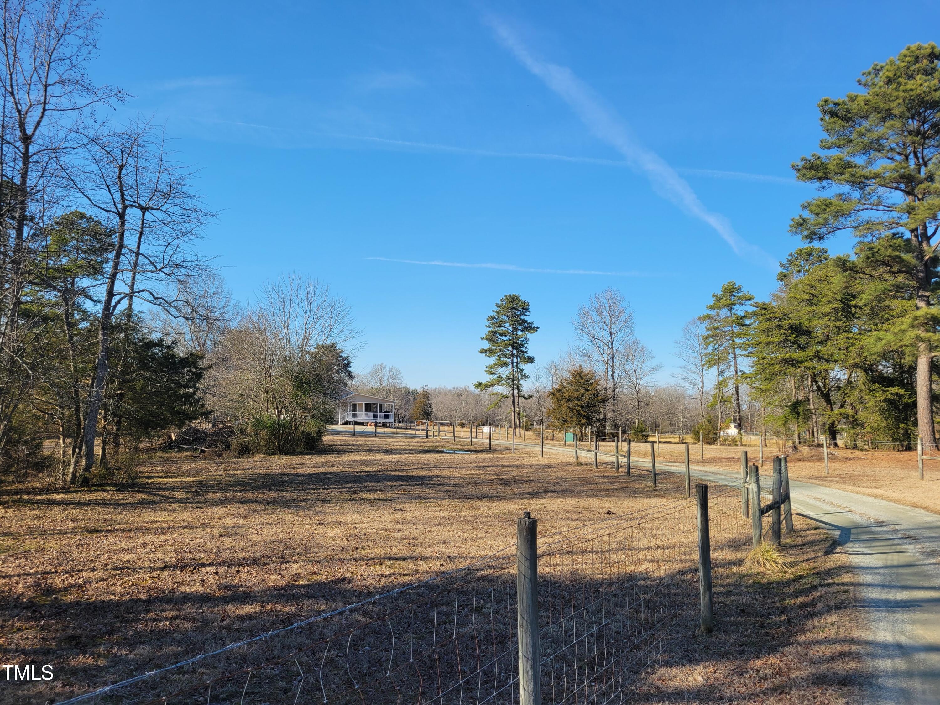 7027 Old 421 Road Julian, NC 27283 - Photo 16 of 72 a view of a yard with an trees
