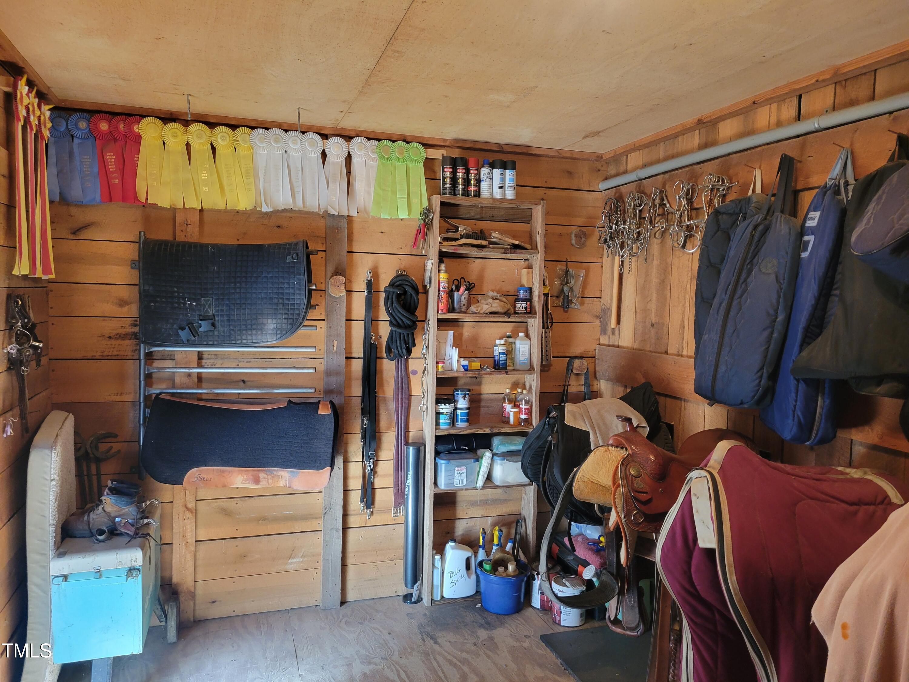 7027 Old 421 Road Julian, NC 27283 - Photo 23 of 72 a view of walk in closet with clothes and shoes