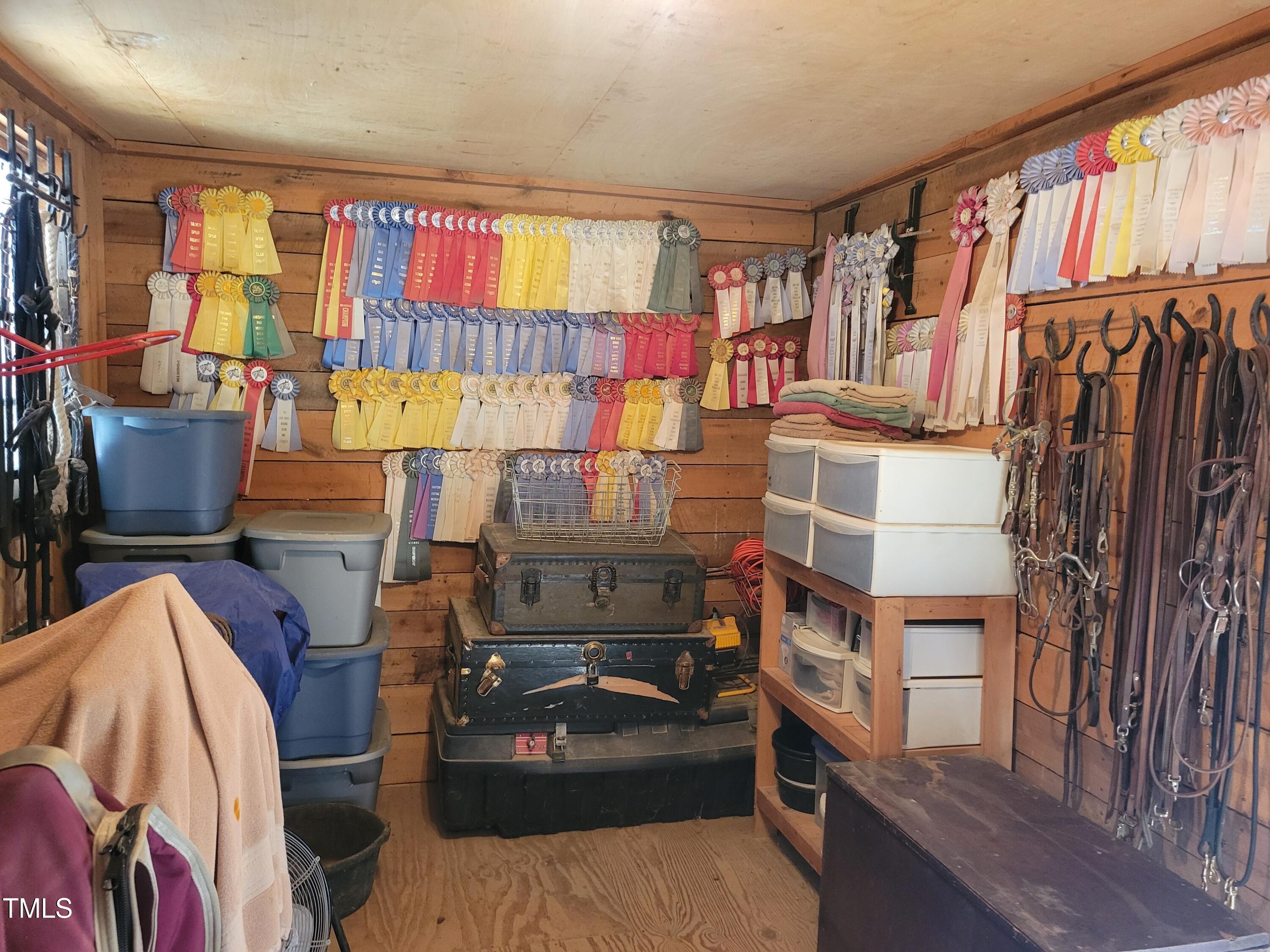 7027 Old 421 Road Julian, NC 27283 - Photo 24 of 72 a view of walk in closet with clothes and shoes