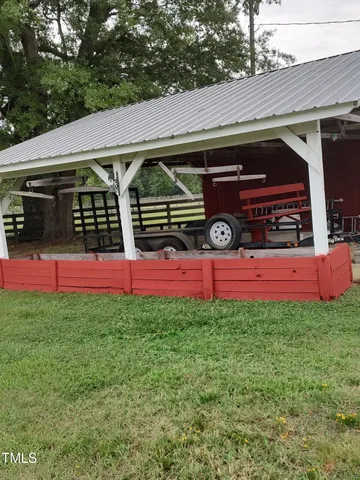 a view of a workspace with furniture and windows