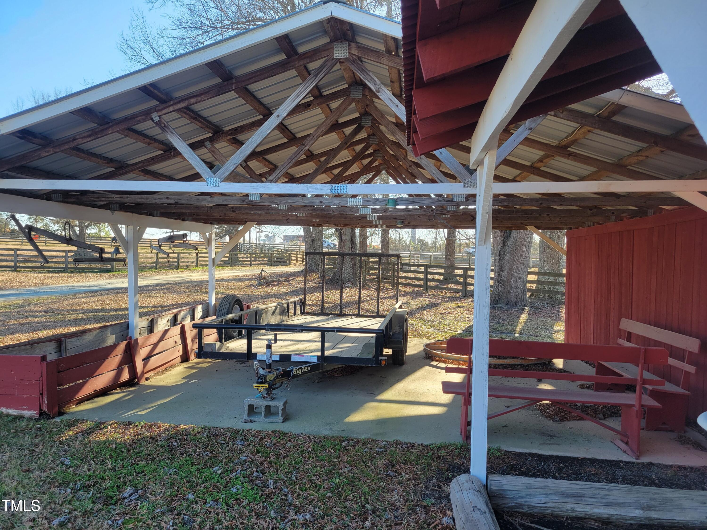 7027 Old 421 Road Julian, NC 27283 - Photo 37 of 72 a view of a porch with furniture