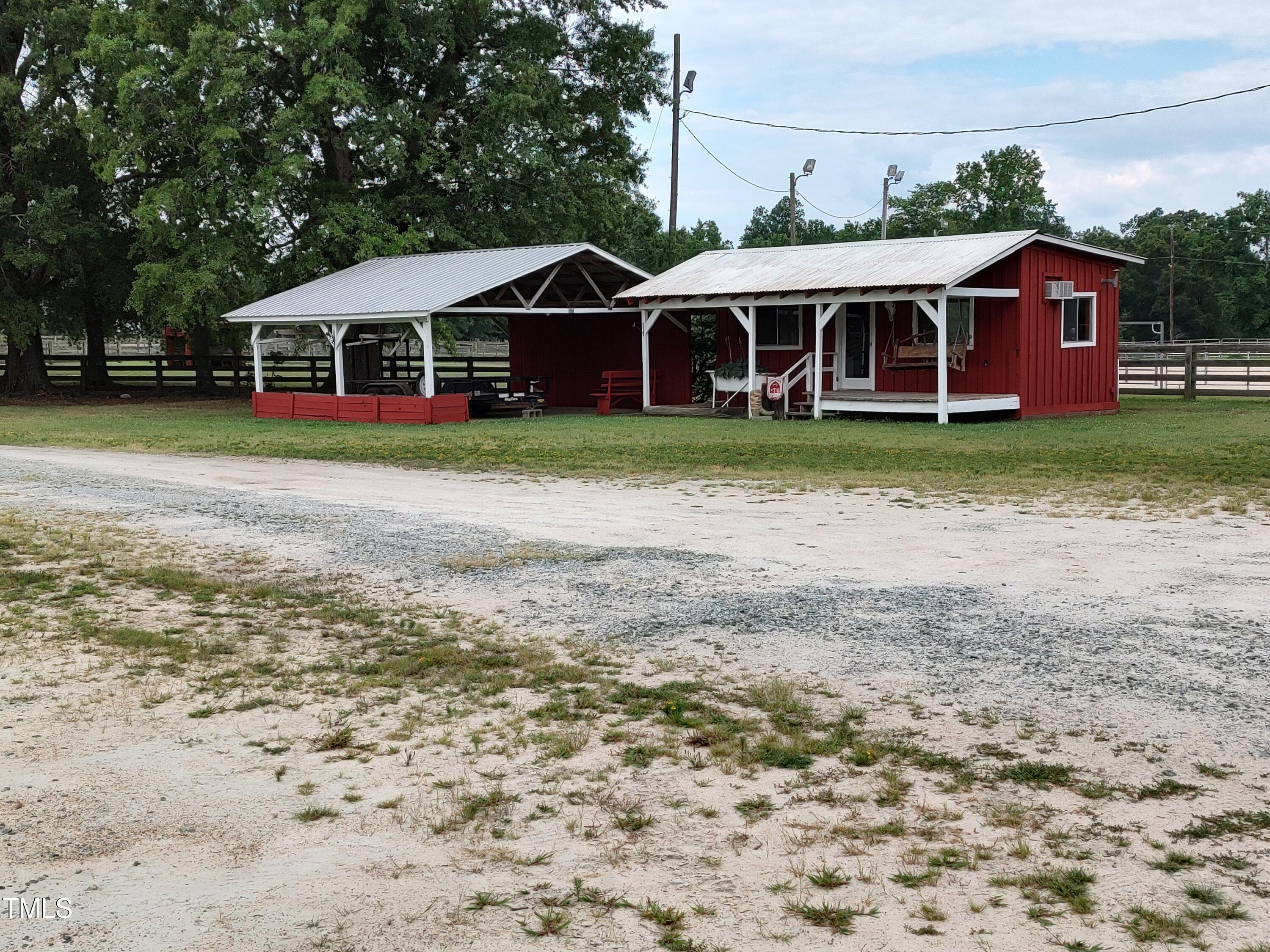 7027 Old 421 Road Julian, NC 27283 - Photo 38 of 72 a front view of a house with a yard