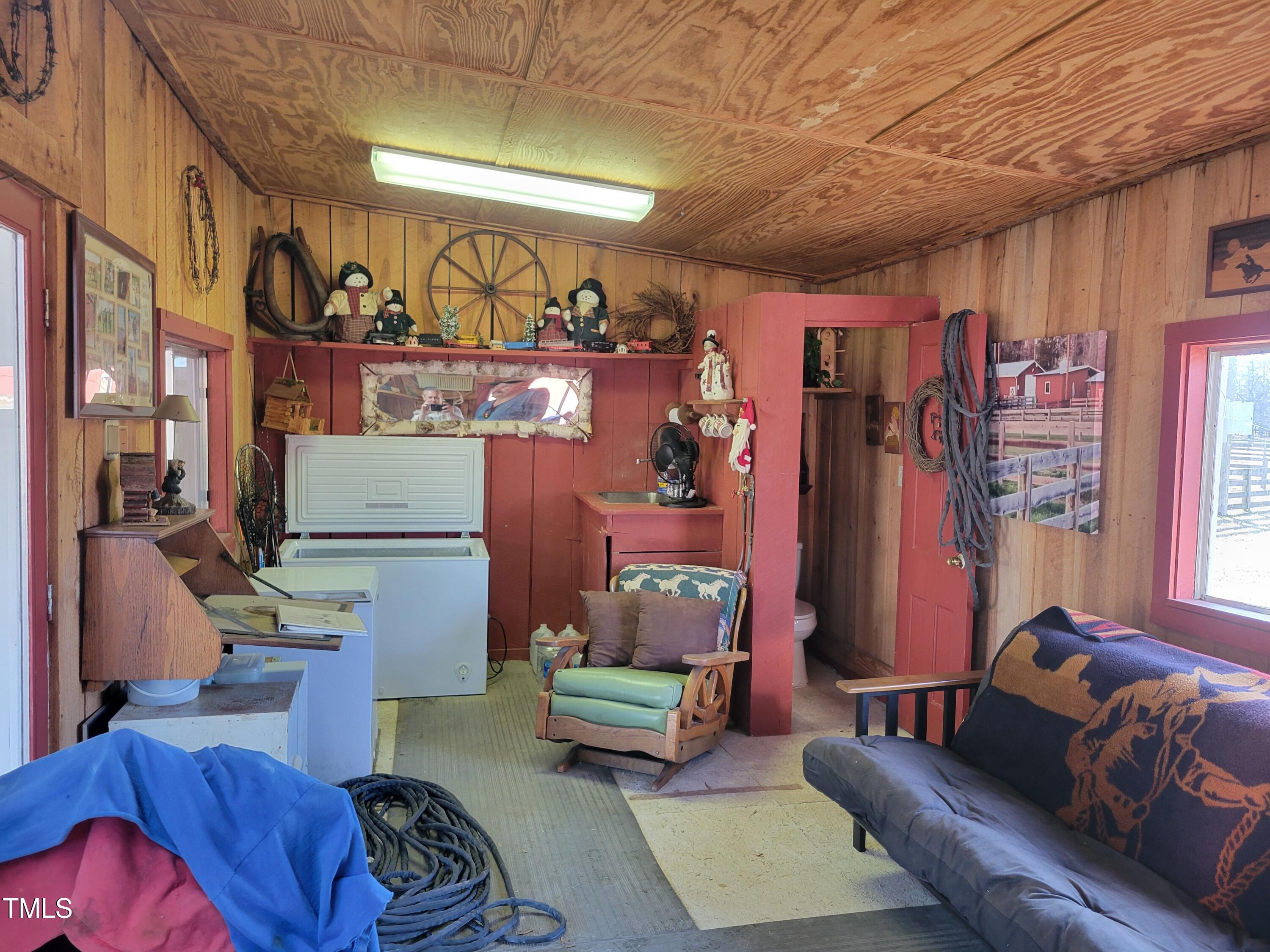 7027 Old 421 Road Julian, NC 27283 - Photo 39 of 72 a living room with furniture and a couch