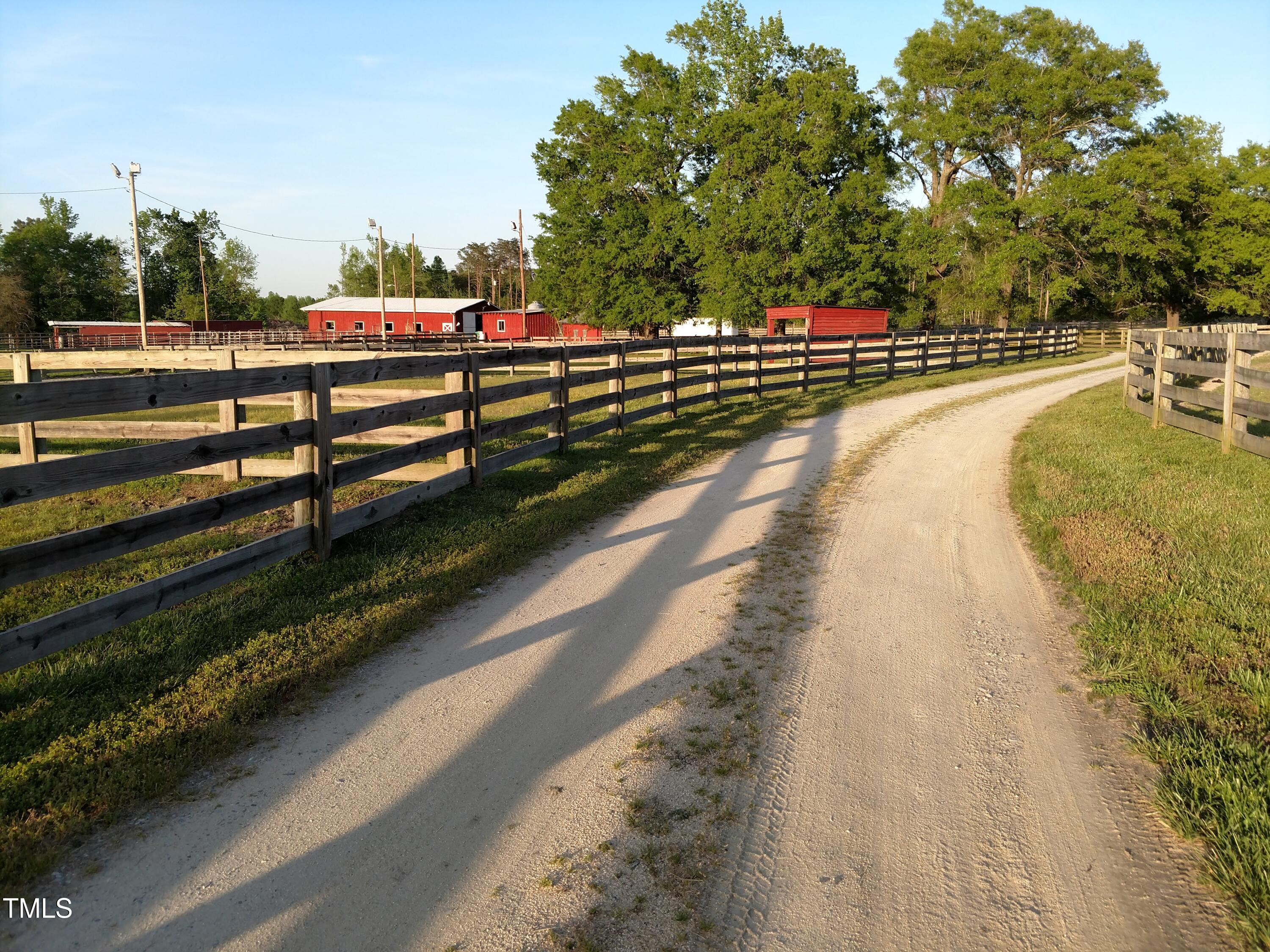 7027 Old 421 Road Julian, NC 27283 - Photo 46 of 72 a view of a swimming pool with a yard