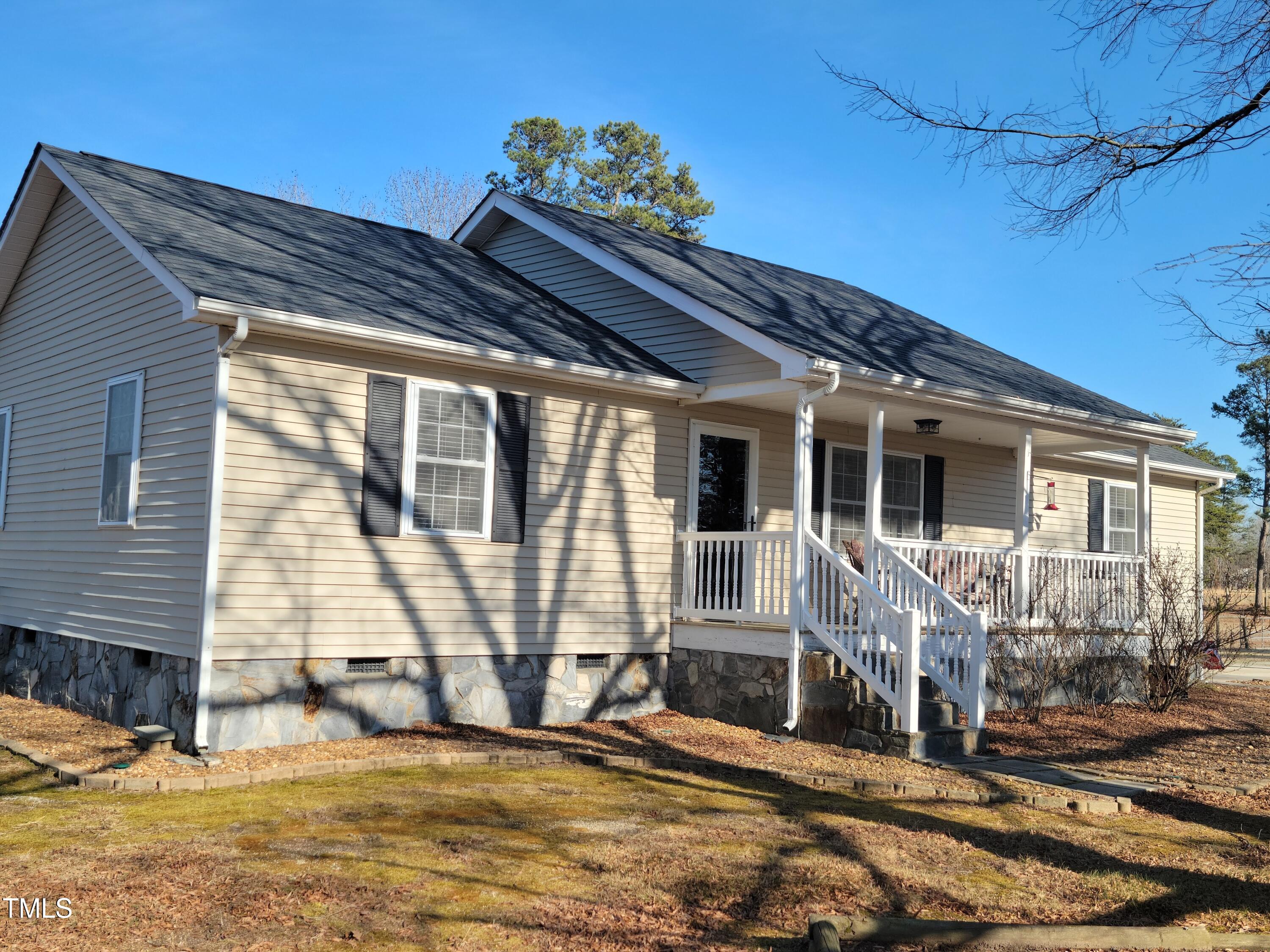 7027 Old 421 Road Julian, NC 27283 - Photo 47 of 72 a view of a house with a patio