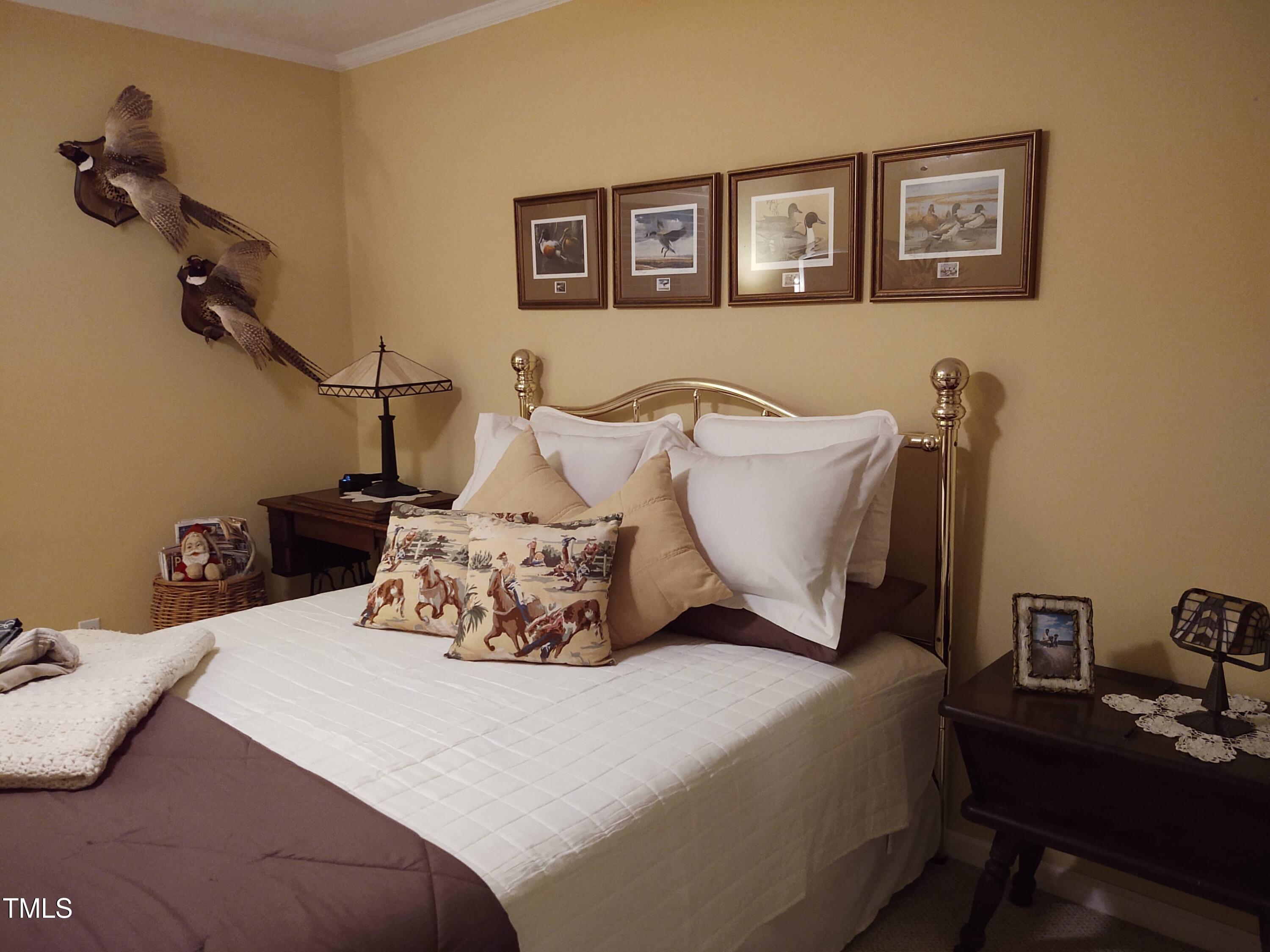 7027 Old 421 Road Julian, NC 27283 - Photo 48 of 72 a bedroom with a bed and a desk