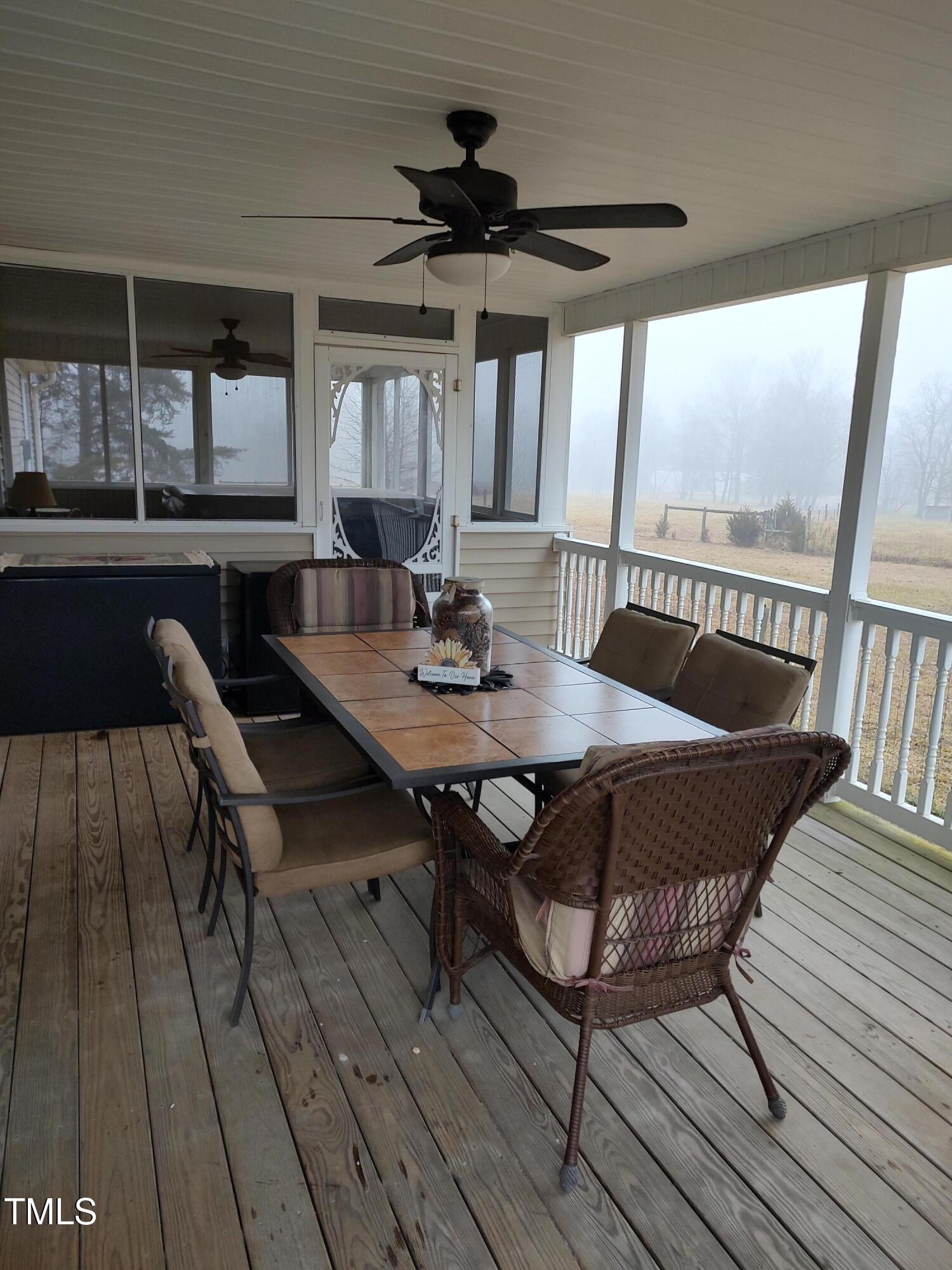 7027 Old 421 Road Julian, NC 27283 - Photo 65 of 72 a view of a dining room with furniture window and wooden floor