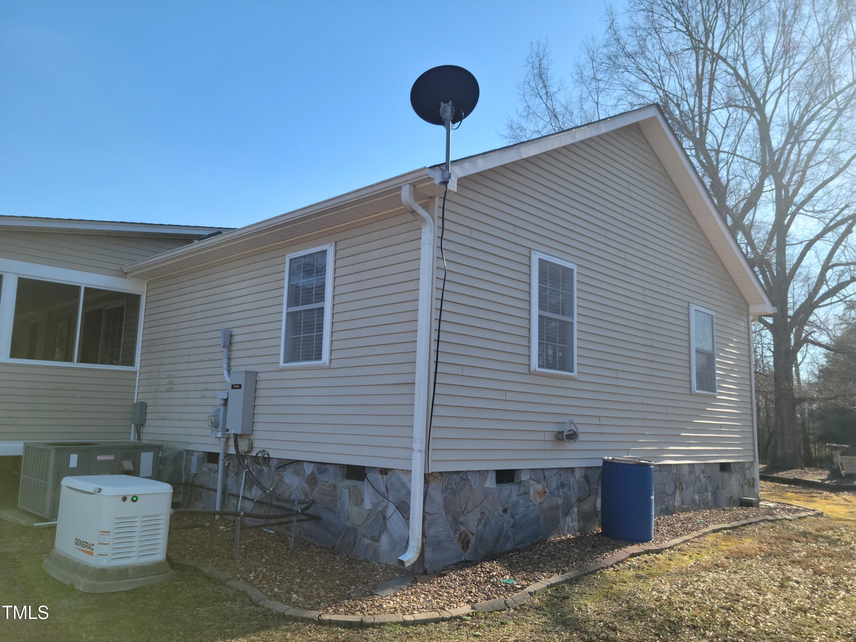 7027 Old 421 Road Julian, NC 27283 - Photo 7 of 72 a front view of a house with a yard