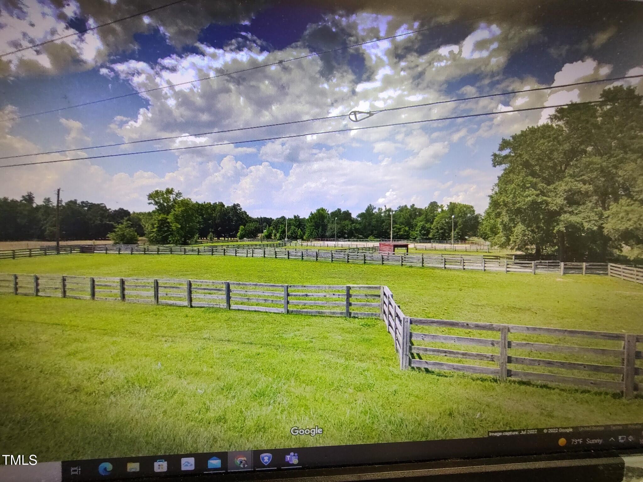 7027 Old 421 Road Julian, NC 27283 - Photo 71 of 72 a view of a lake with houses in the background