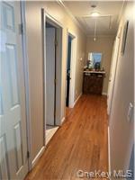 2 1st Street Coram, NY 11727 - Photo 24 of 36 a view of a kitchen from the hallway