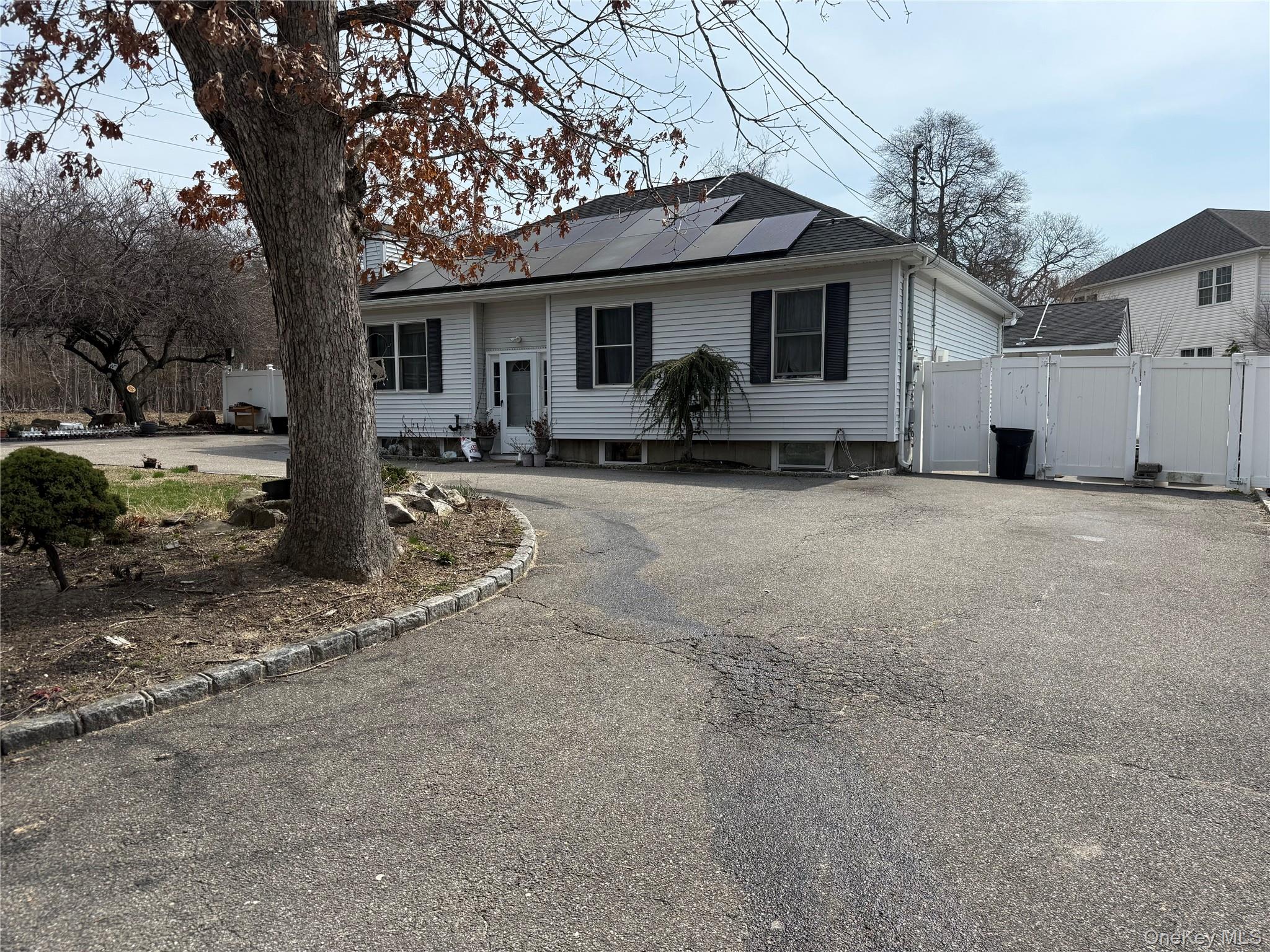 2 1st Street Coram, NY 11727 - Photo 3 of 36 a view of a house with a yard