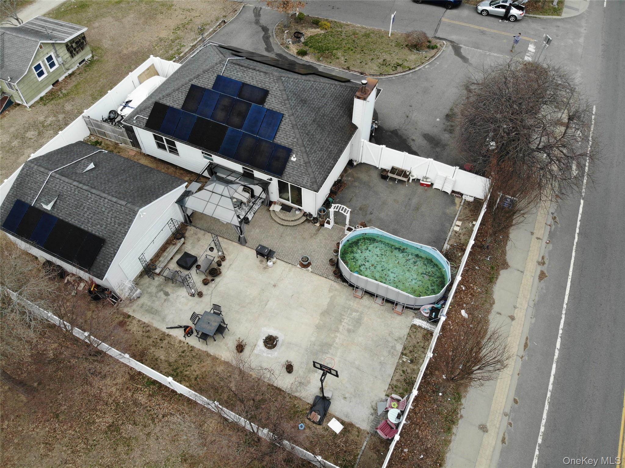 2 1st Street Coram, NY 11727 - Photo 33 of 36 an aerial view of a fireplace with table and chairs