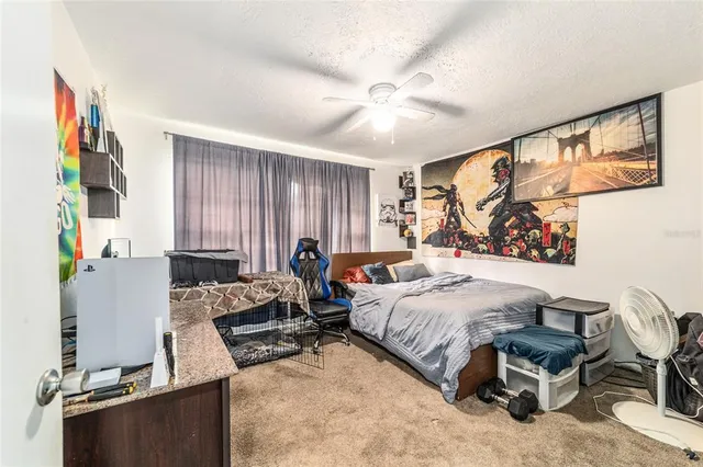 a bedroom with furniture and a window