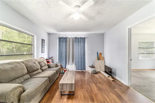 a living room with furniture and a large window