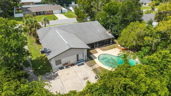 an aerial view of a house with a garden